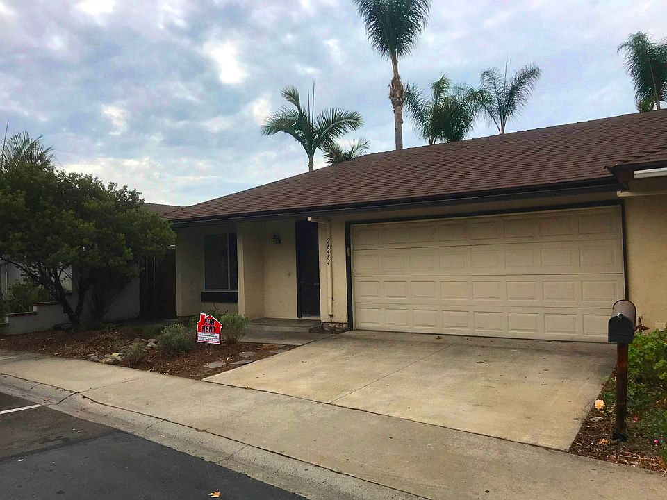 2 car garage and driveway, drought-tolerant landscaping.