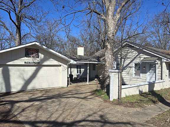 View of Garage, outside covered area, and entry into the kitchen.