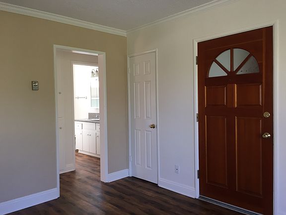 view of the hall & bathroom grainte counters