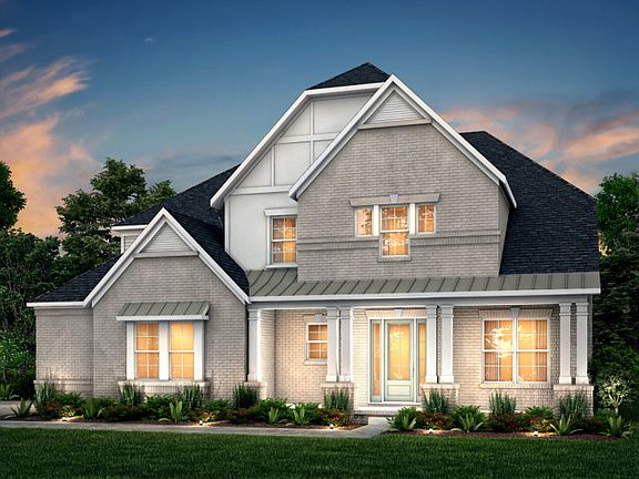 Barrington Exterior 11 features brick, hardie siding, covered front porch and 3 car sideload garage