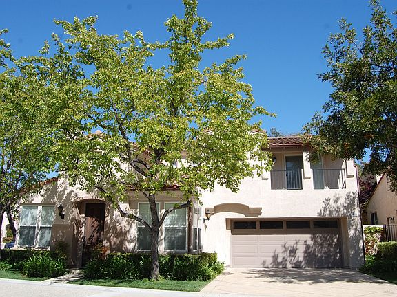 Front view of detached home with 2 car garage