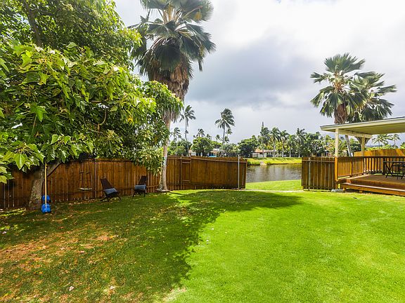 Fenced in back yard with access to the canal.