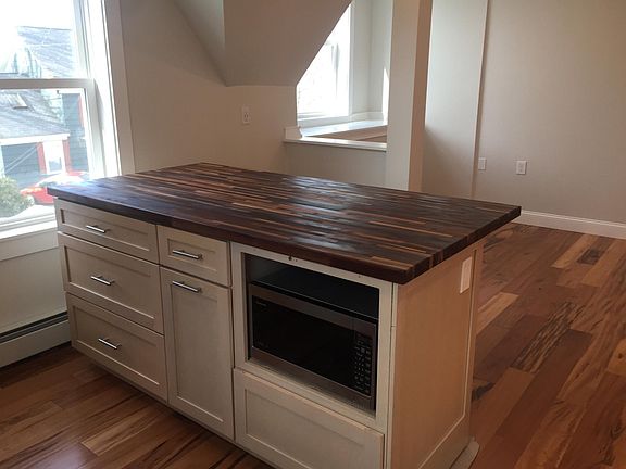 Kitchen Island with microwave and butcher block countertop