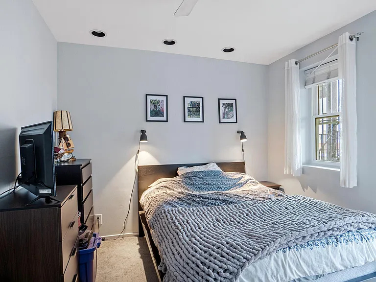 Queen or full size bed easily fits in the bedroom with two windows and two closets