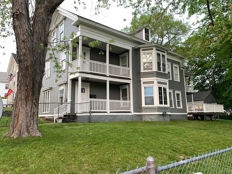 Front entrance and fenced in yard on the side