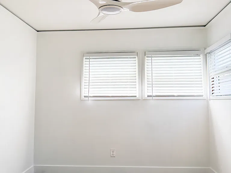 Bedroom 1 with ceiling fan and ocean breeze.