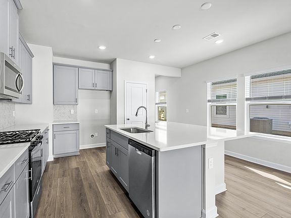 The well-appointed kitchen features plenty of counter space to make meal prep a breeze.