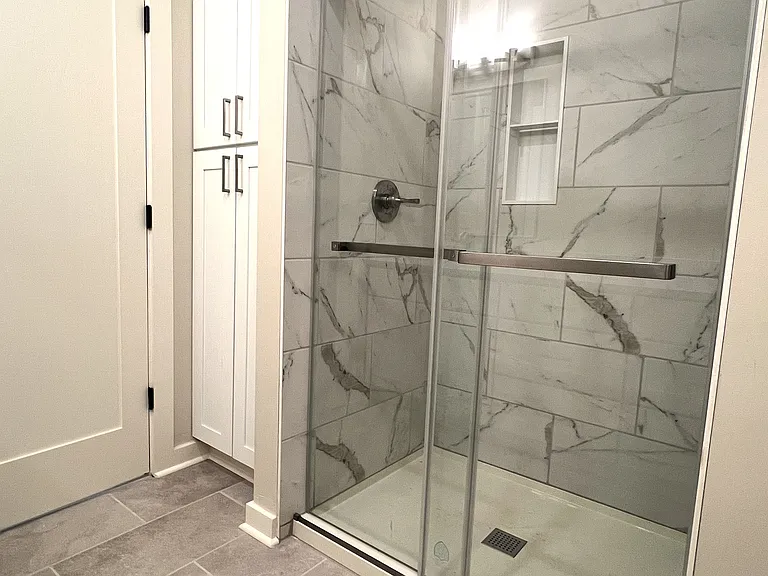 Primary Walk-In Shower & Large Linen Cabinet