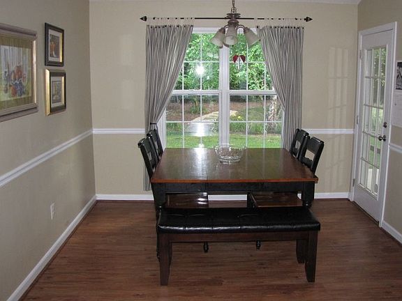 Dining room with view to park-like, wooded backyard.  Very private!