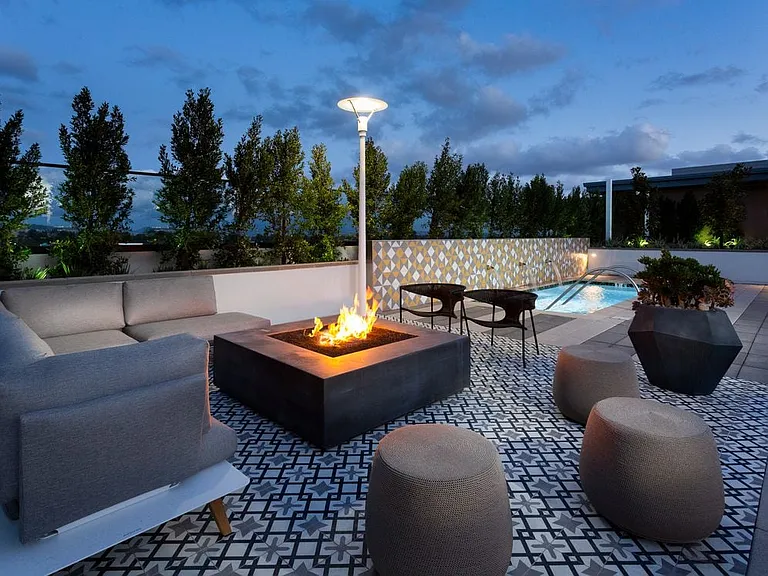 Building B rooftop with fireplace and lounge seating
