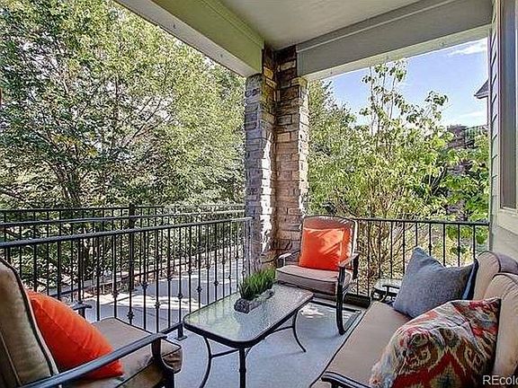 Main floor patio overlooks private park and lake