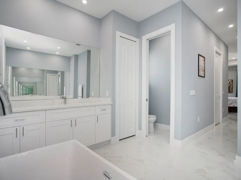 Toilet with hand-bidet sprayer
