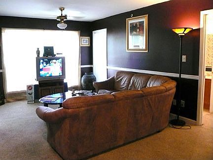 Open living room with lots of windows for natural light.