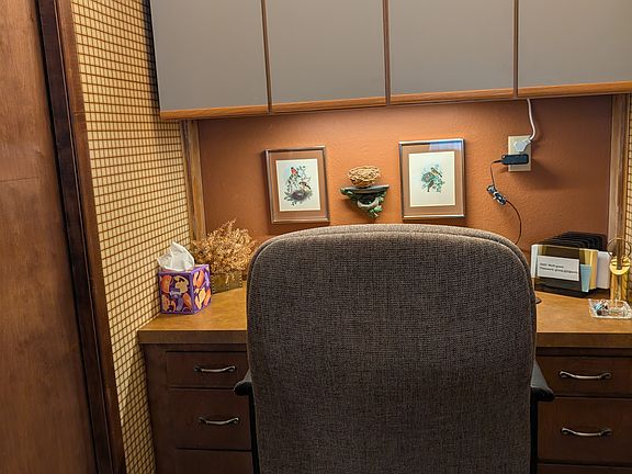 Desk with rolling office chair and high speed wi-fi