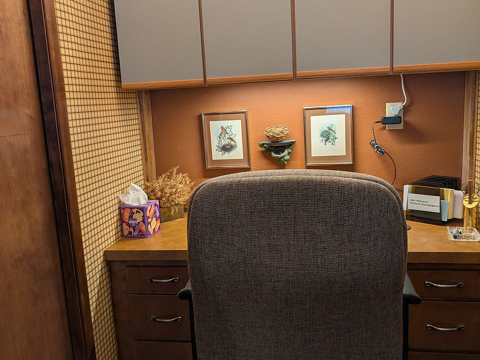 Desk with rolling office chair and high speed wi-fi