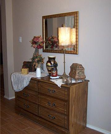    Foyer with great ceramic wood floor and plenty of room for your favorite entry piece.