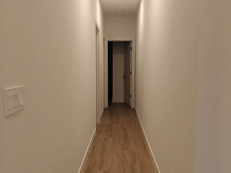 Hallway from the kitchen to bedrooms and bathroom.