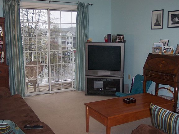 LIVING ROOM WITH SLIDERS TO BALCONY!