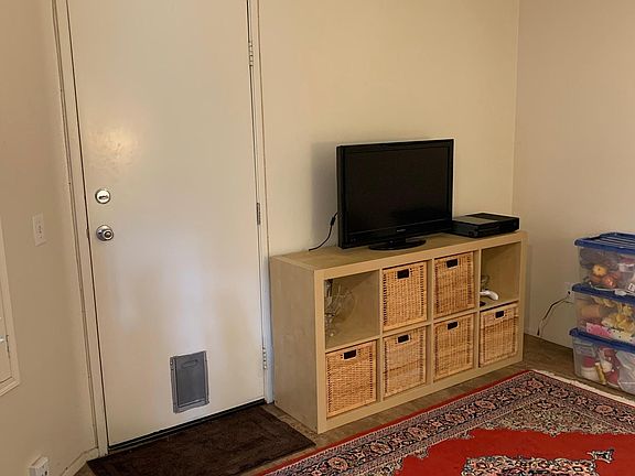 Den with access to garage