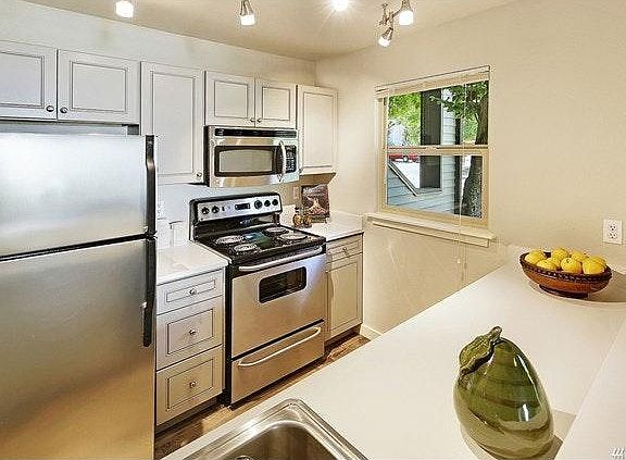 Updated kitchen cabinets. Beautiful and easy to maintain qua