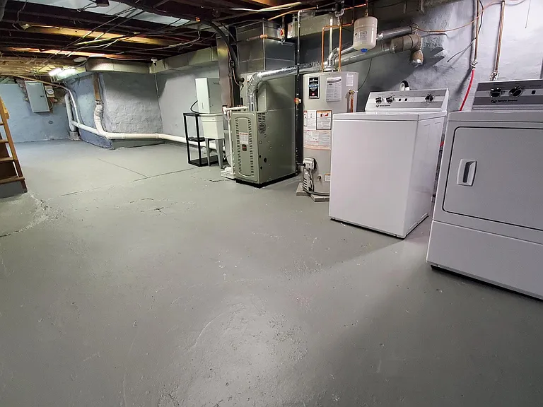 Clean basement with newer laundry
