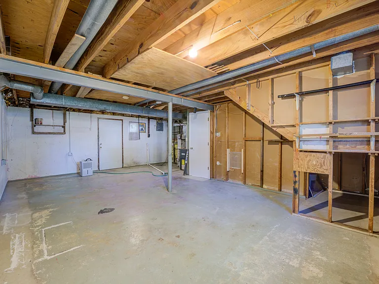 Lower level storage with walk-out door and washer/Dryer hookups.