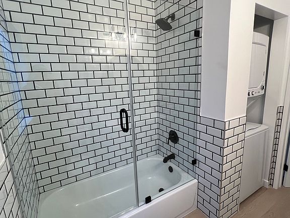 bathroom with a view of the laundry location