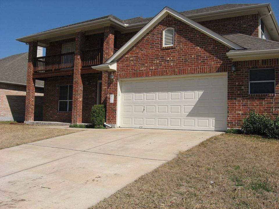 Front of Home with 2.5 Car Garage and Balcony