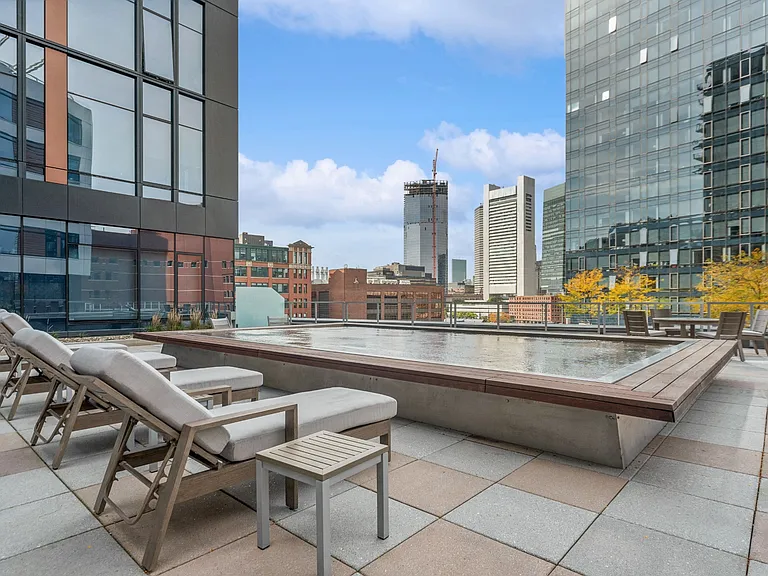Sun Deck Lounging Area with Cityscape Views