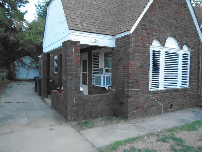 View of the north east corner of 124 NW 31st Street, from approximately 30 feet away from the building.
