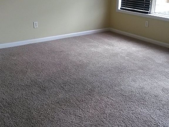 Dining room with drop down lighting fixture.
