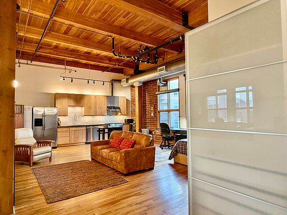 Overall look of the loft upon entry. New wardrobe on rights.