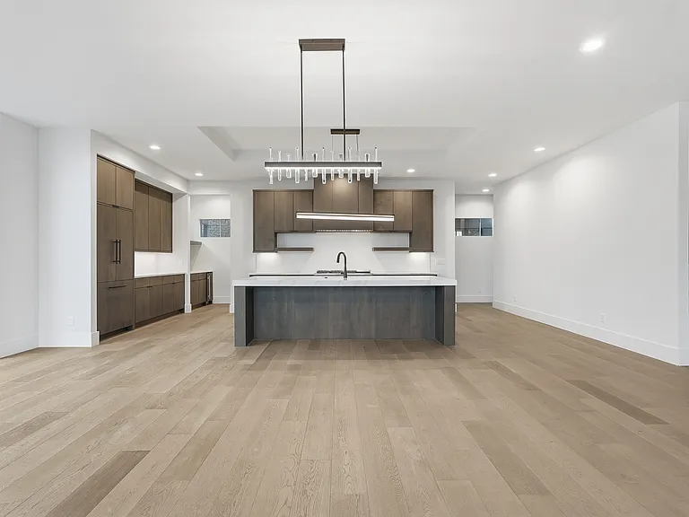 Perfect for entertaining- open kitchen with a statement island and sleek, modern finishes.