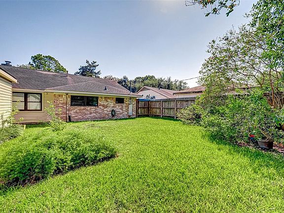 Landscaped backyard with lots of room for family gatherings and room to play.