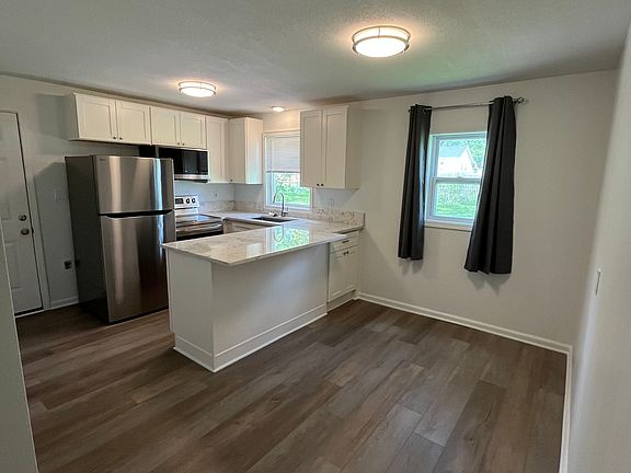 Kitchen area. 
Refrigerator has icemaker.