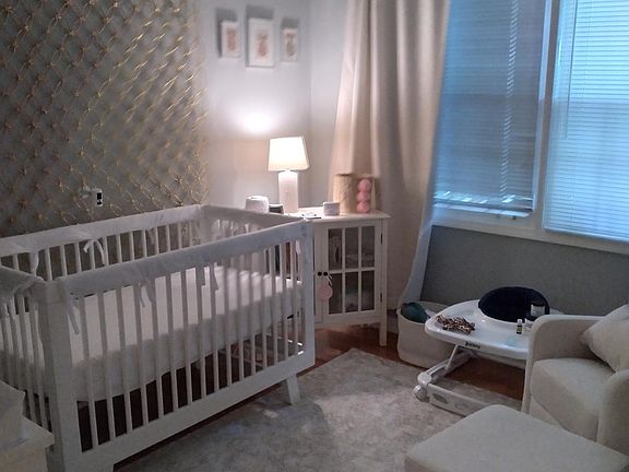 Bedroom with prior tenant's furniture