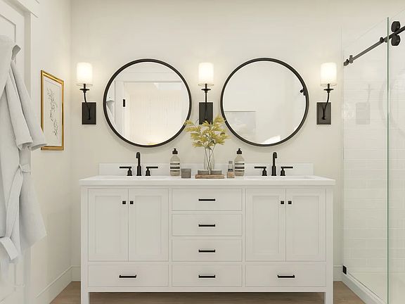 Primary bath features freestanding vanity with dual sinks