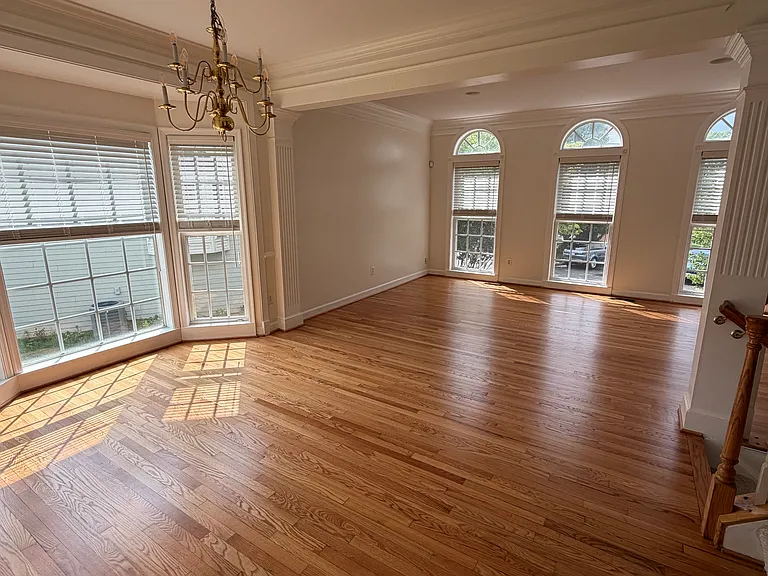 Living room on the right and dining room and bay window on the left