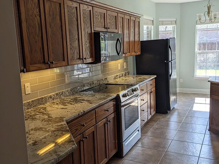 Granite counter tops (*black refrigerator not included)