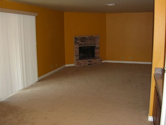 Living room with woodburning fireplace