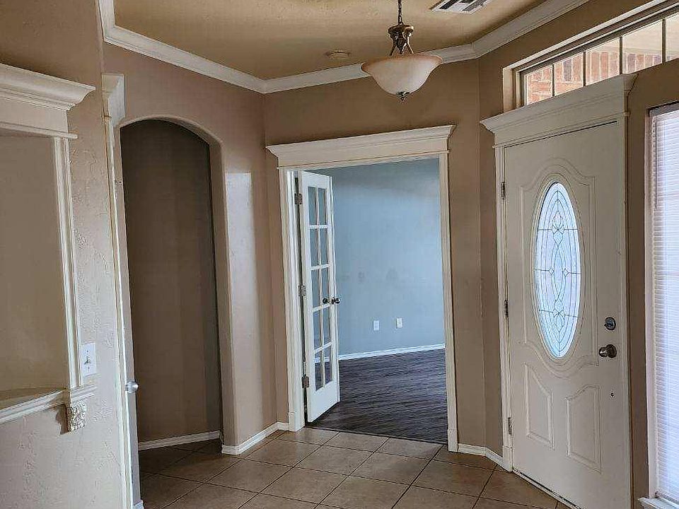 As you enter the entryway, the kitchen is on your right and the office is right to the left. The office could be a 4th bedroom