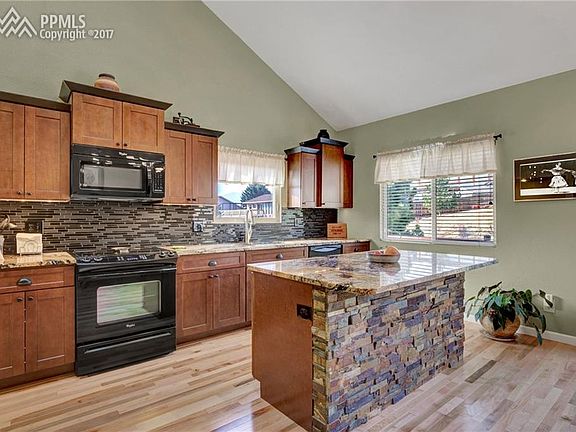 Custom gourmet kitchen with granite countertops and maple cabinets!