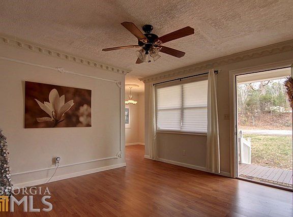 Front Door Opens to Family Room with Hardwood Floors