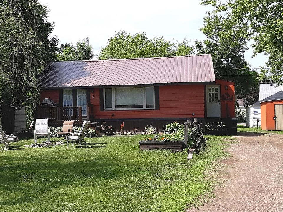 Storage shed, off-street parking. Gas grill and fire pit. 10,000 BTU window A/C unit cools main floor living area.