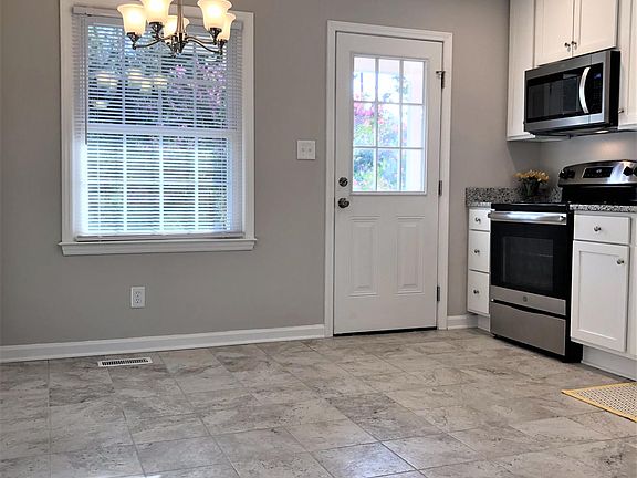 Room for a large dining table with a view of the backyard