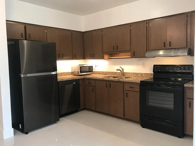 Kitchen with granite counter-tops.