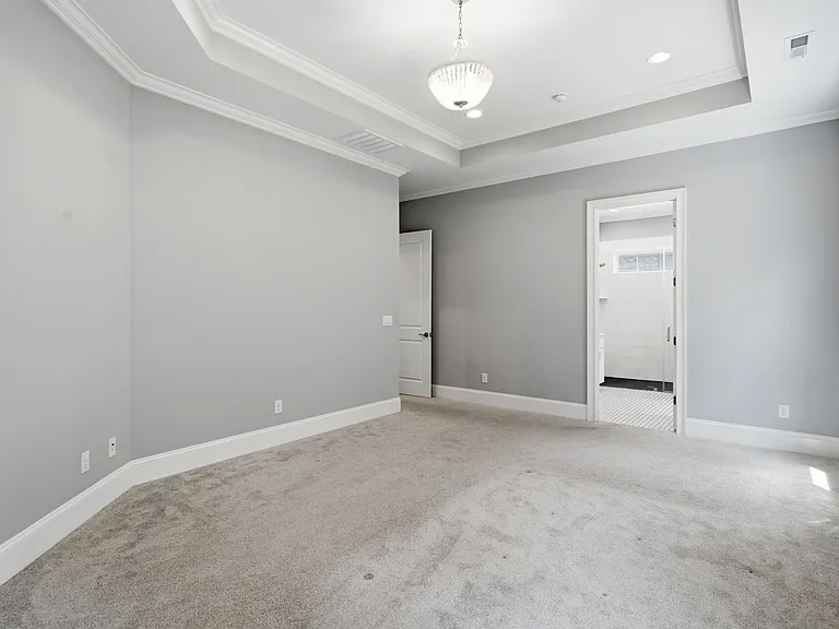 Another view of the primary bedroom
