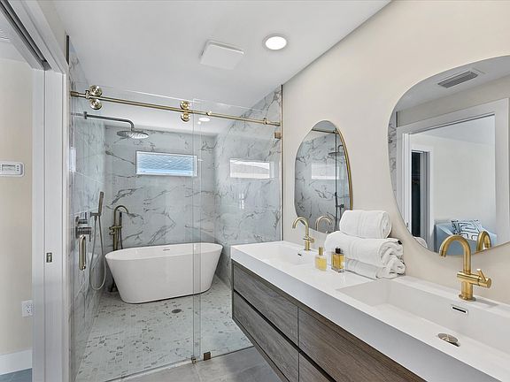 Spa-like master bath with wet room, rain shower and freestanding tub