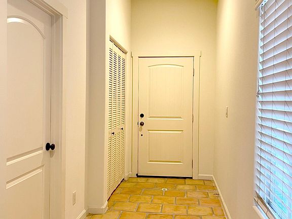 Half bathroom and storage in entrance area