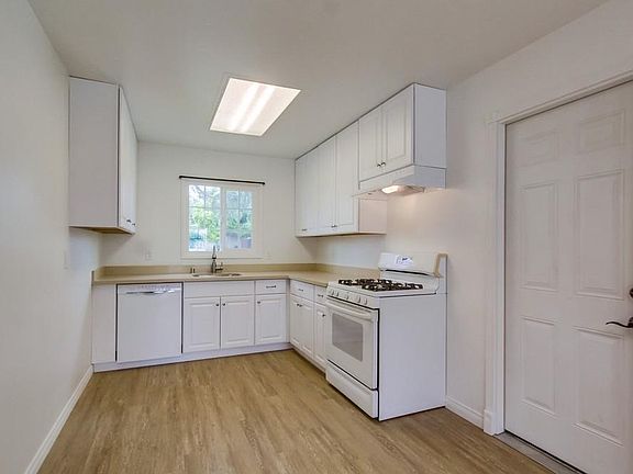 All new kitchen cabinets and quartz counters